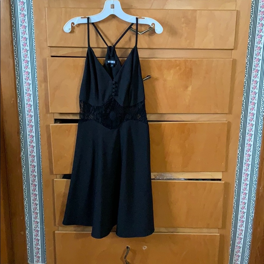 black thin strap dress. flare bottom